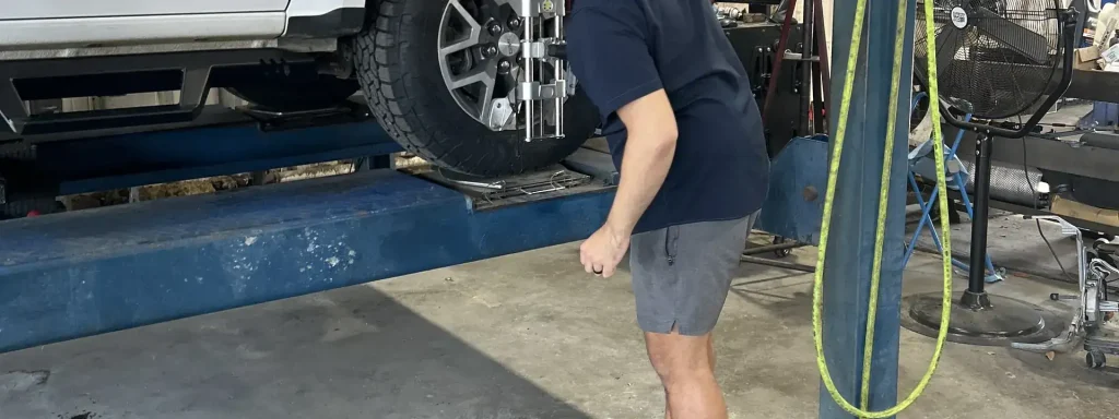 GMC Canyon on the alignment rack with wheel targets attached