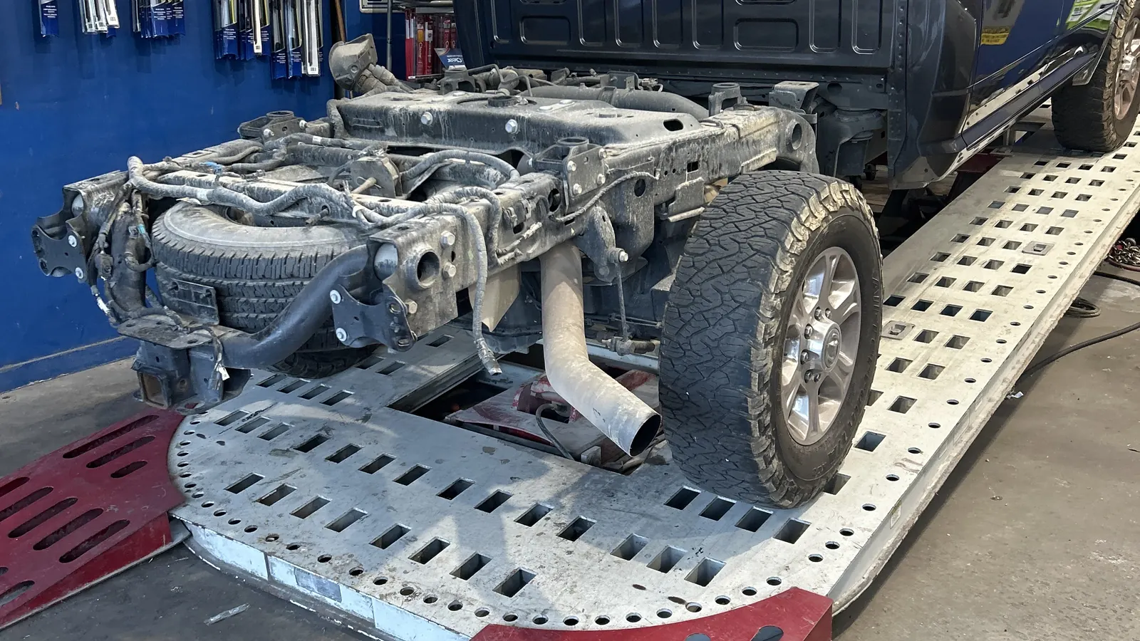 Pickup on the frame straightening machine with the front end removed for collision repair