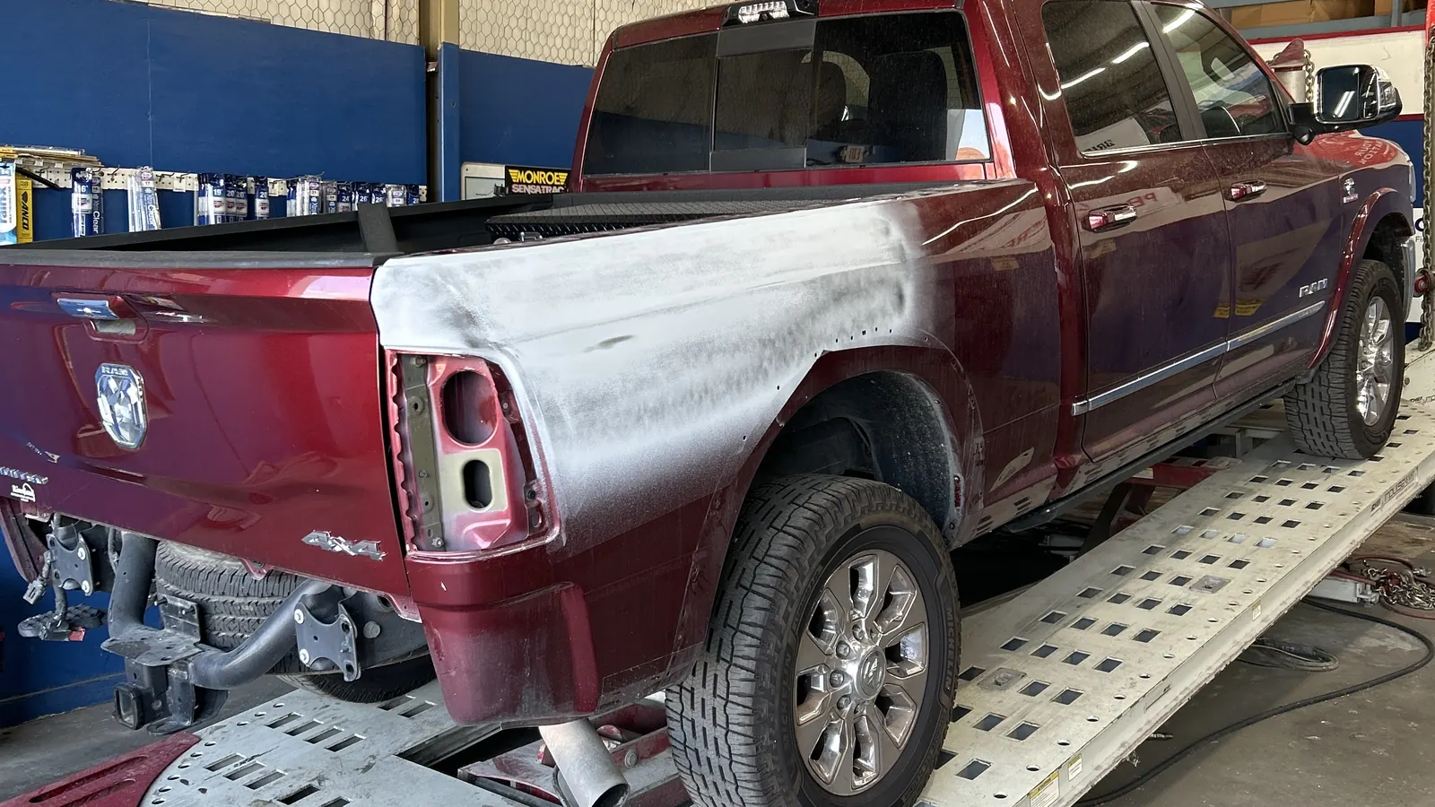 Ram 1500 pickup on the frame bench during collision repair at Gordon & Sandifer in Baton Rouge