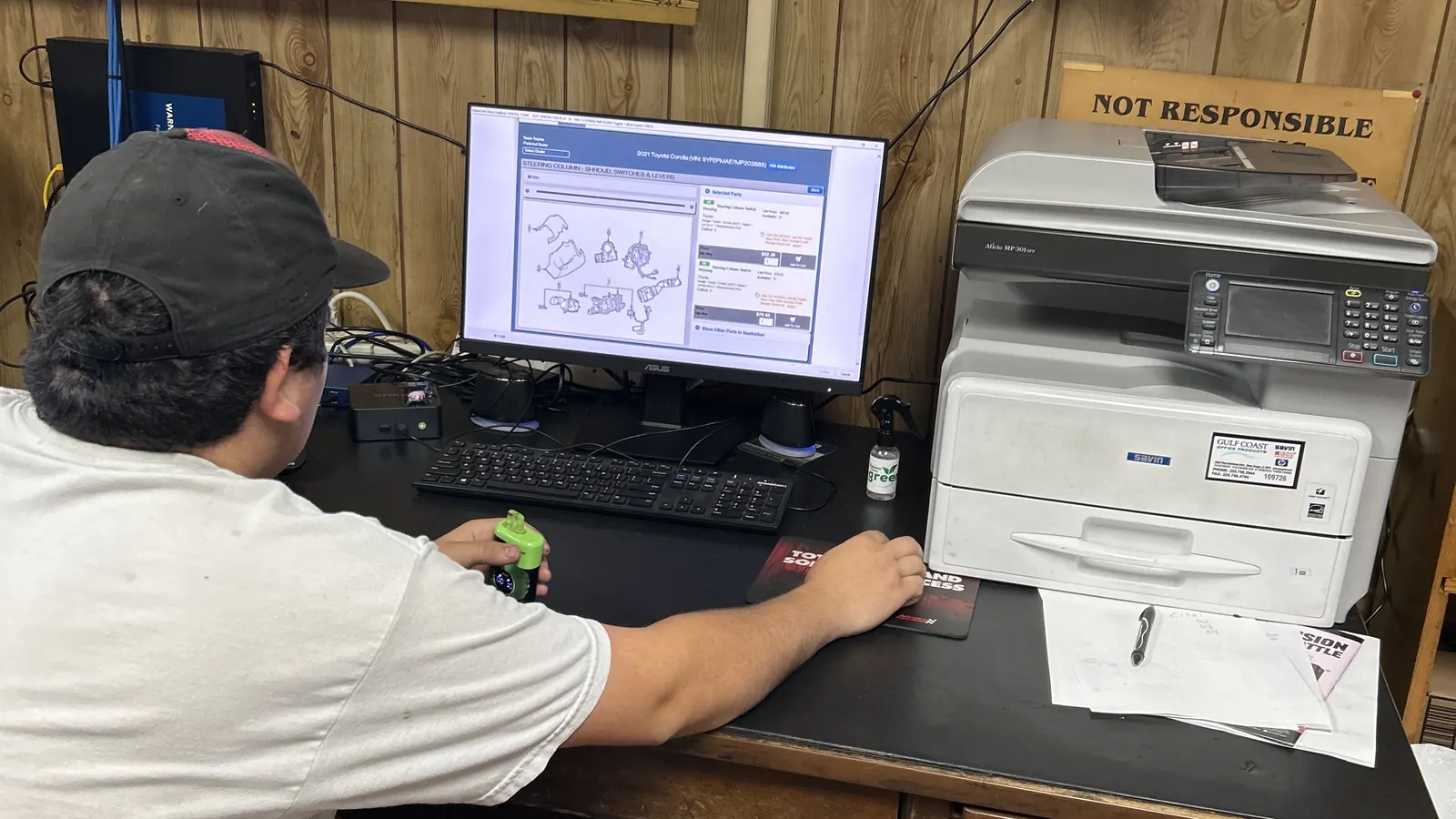 Service advisor reviewing repair information at the front desk