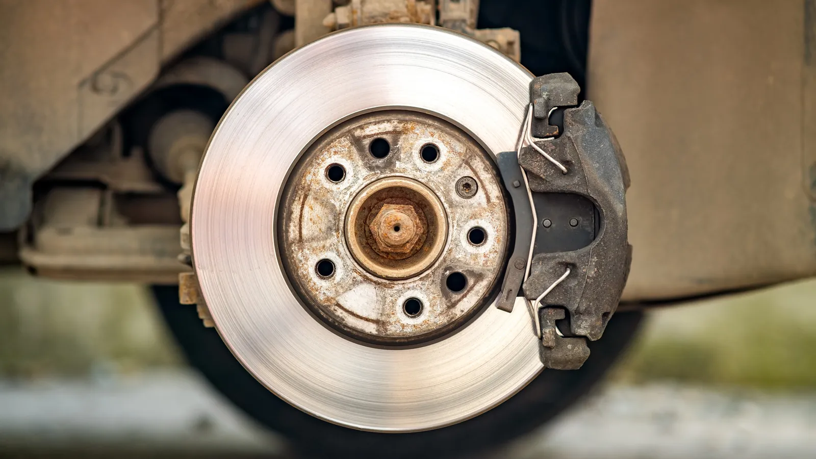 Brake rotor and caliper on a car with the wheel removed